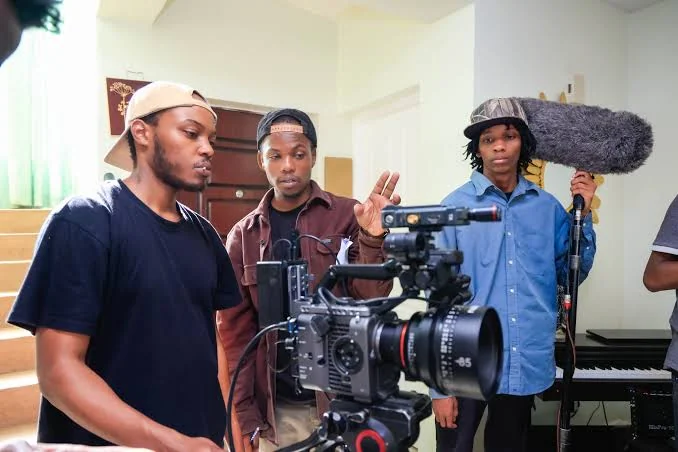 Sir Lorenzo's Filmhut crew on a multi-camera production set with cinema camera and boom mic